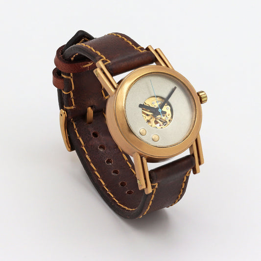 Wristwatch with brown leather strap and gold case on a white background