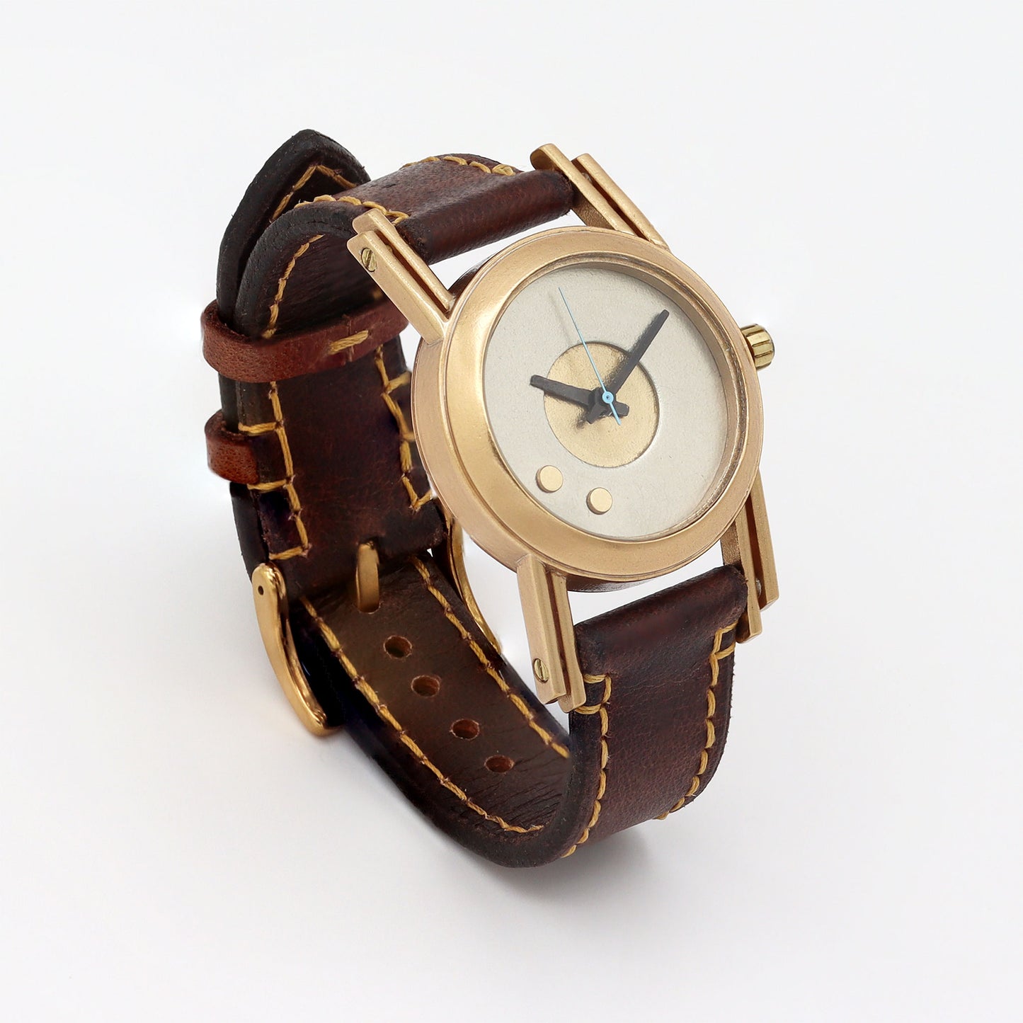 Retro futuristic wristwatch with brown leather strap and bronze casing on a white background