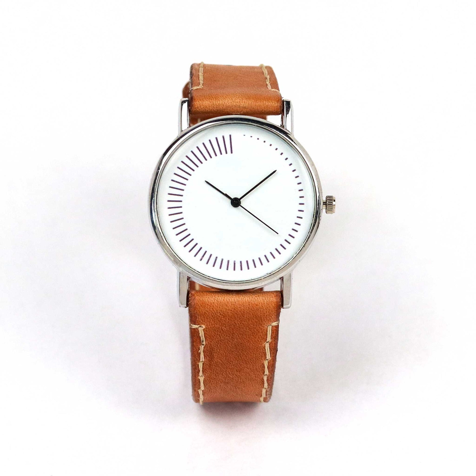 minimal watch design without numbers and brown strap