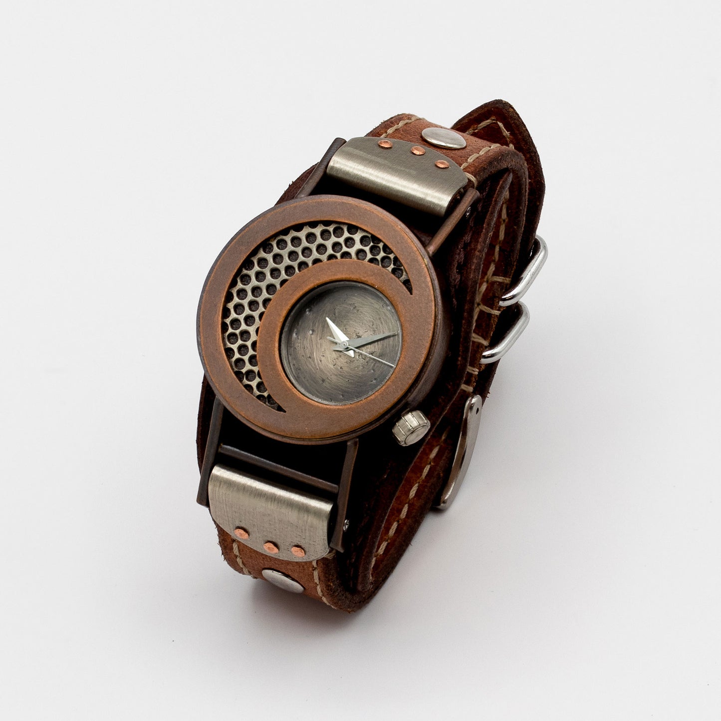 Brown leather wristwatch with metallic accents on a white background
