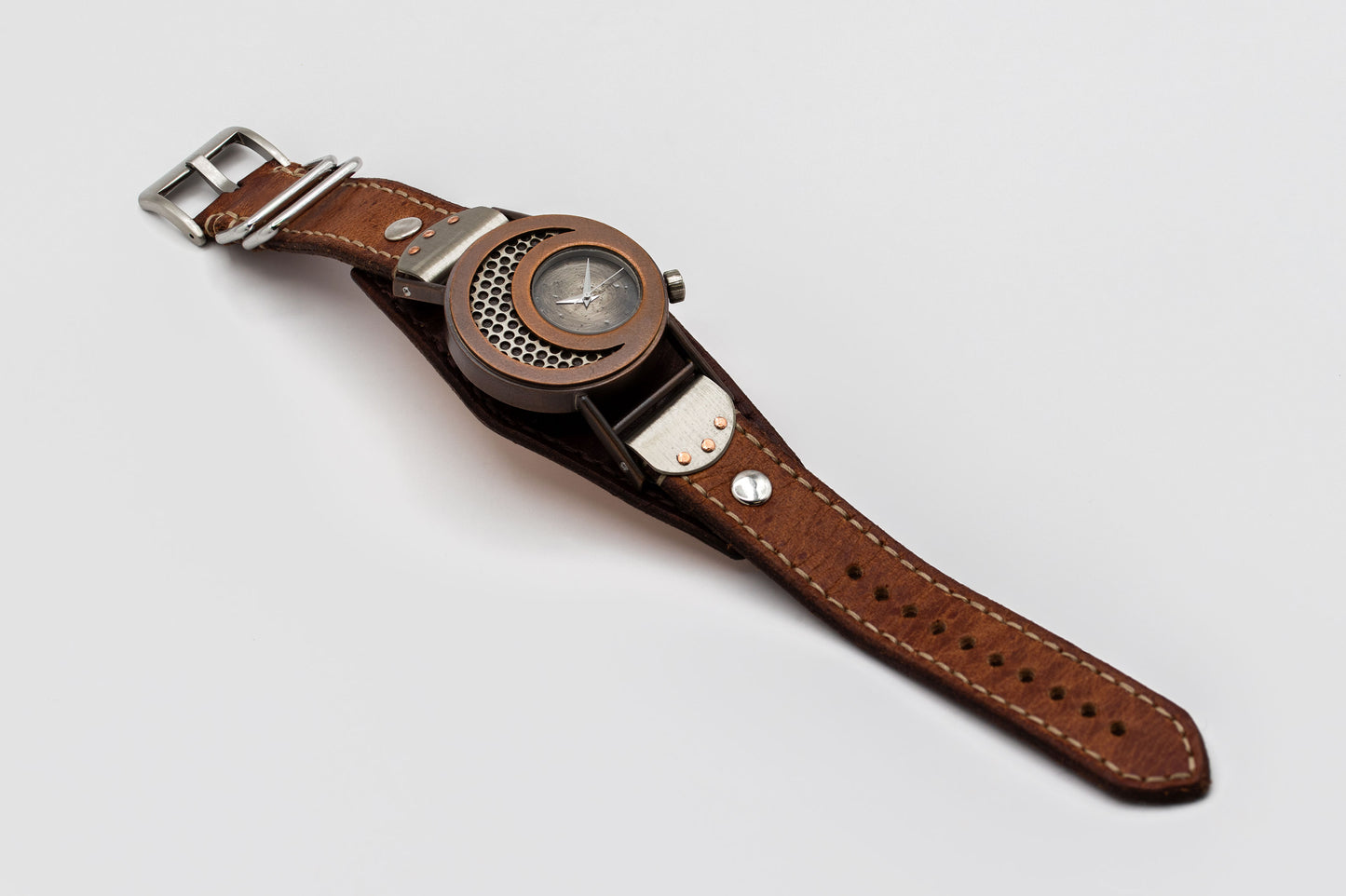 Watch with a brown leather strap on a light gray background