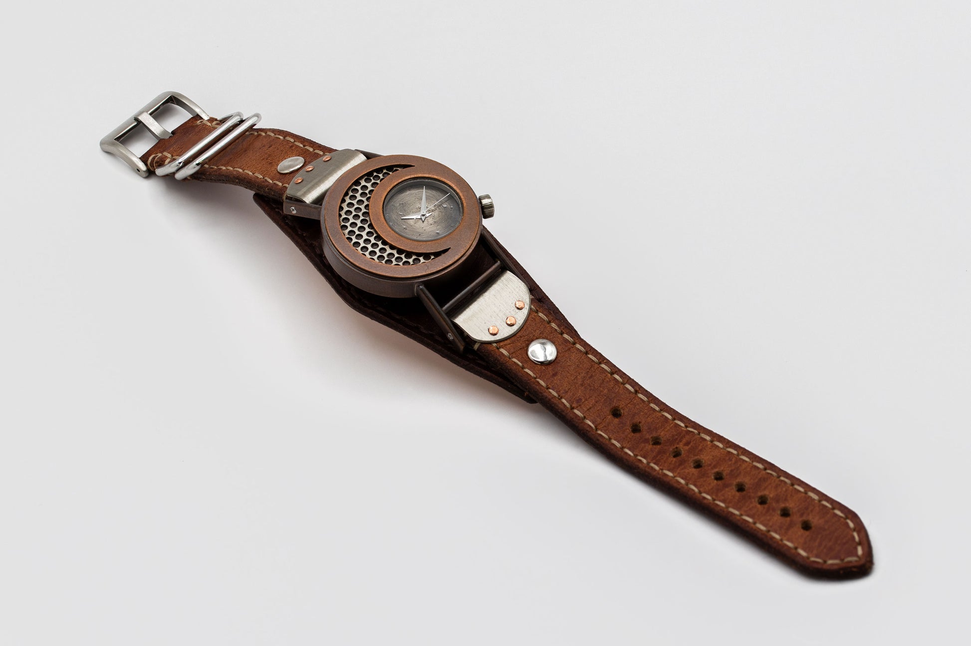 Watch with a brown leather strap on a light gray background