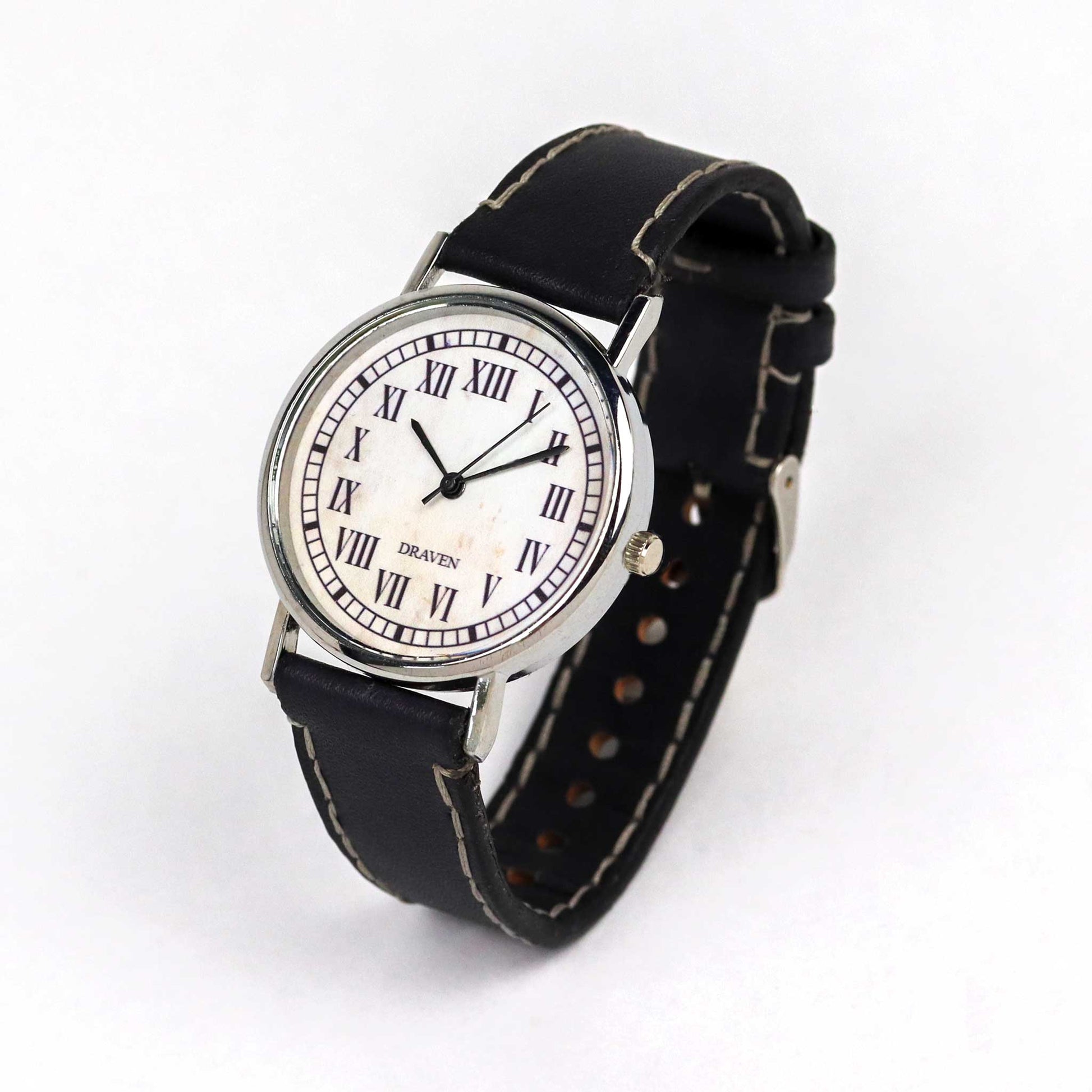 angled view of a Thirteen Hour Wrist Watch with a black strap