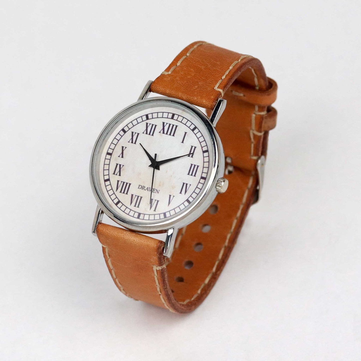 side view of a thirteen hour wrist watch with brown strap