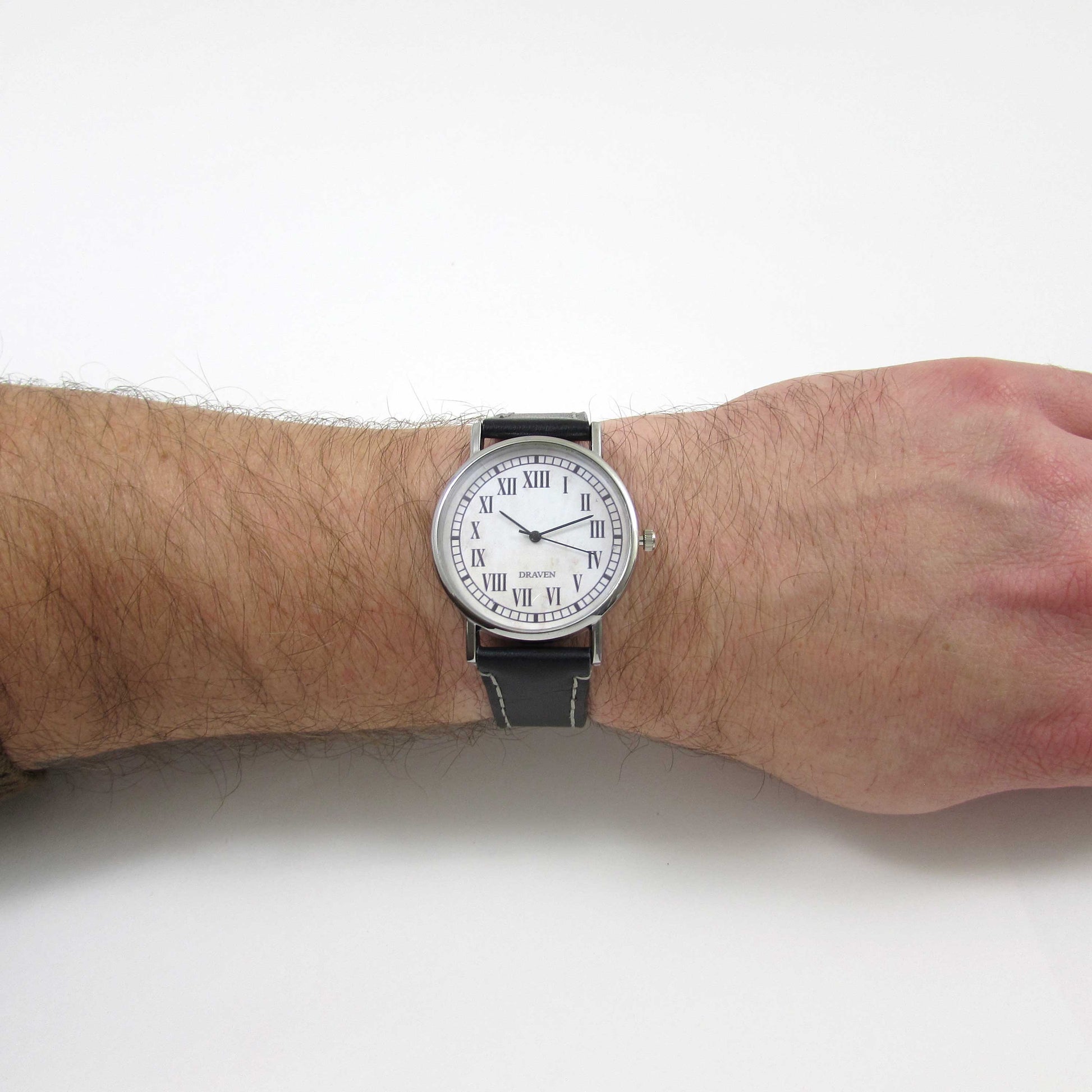 thirteen hour wrist watch displayed on a wrist