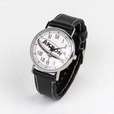 side view of the city of akron black strap wrist watch