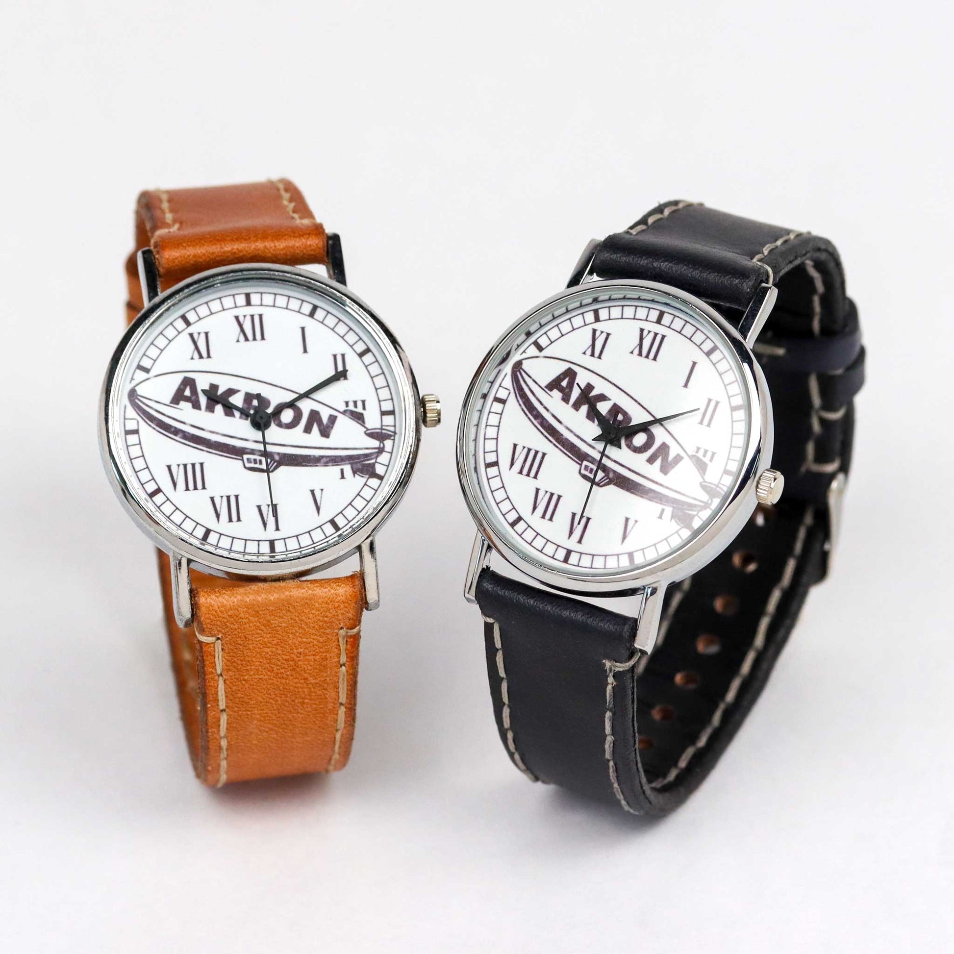 wrist watches with a blimp and akron on the dial
