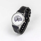 brain illustration on the dial of a black leather wrist watch