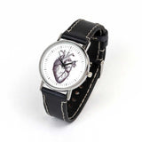 heart illustration on wrist watch with black leather strap