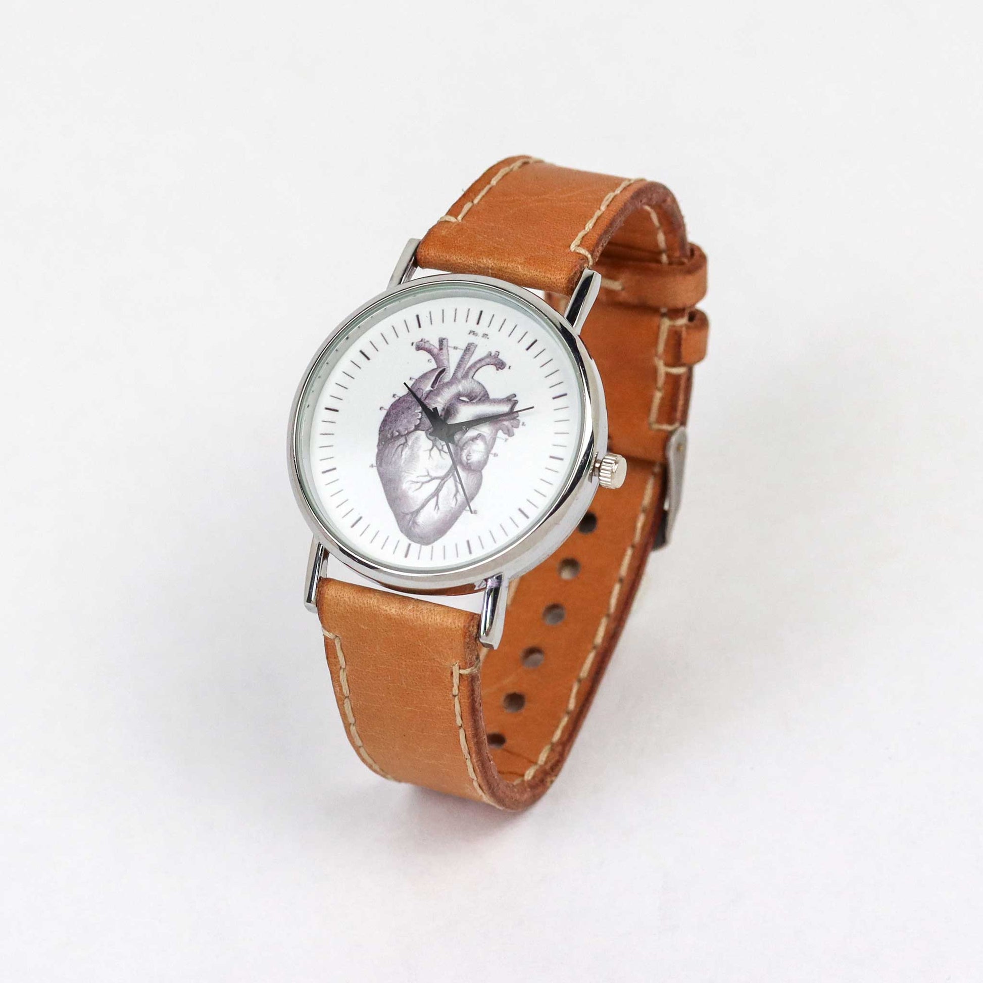 Brown leather wrist watch with a heart