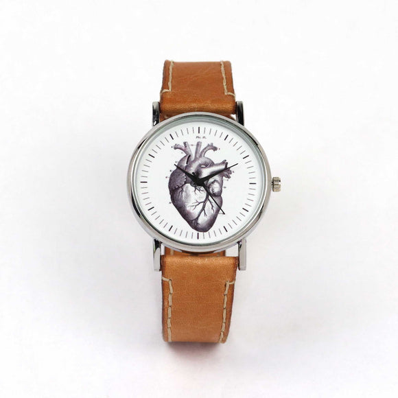 wrist watch with a heart illustration on the dial
