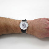 Alice in Wonderland Black Leather watch displayed on a wrist