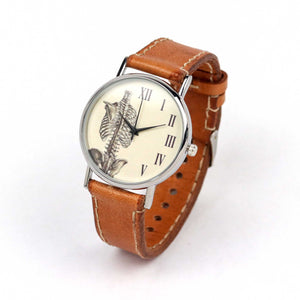 skeletal system wrist watch with a brown strap