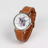 brown leather wrist watch with the white rabbit on the dial